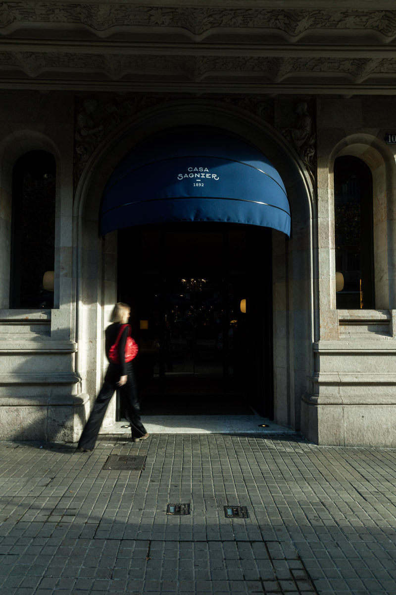 woman walking into a hotel, blurry photo