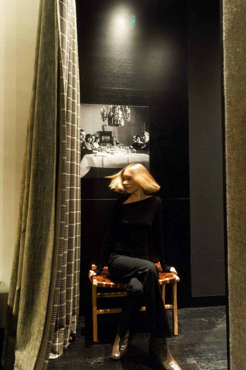 woman sitting on a chair, blurry hair