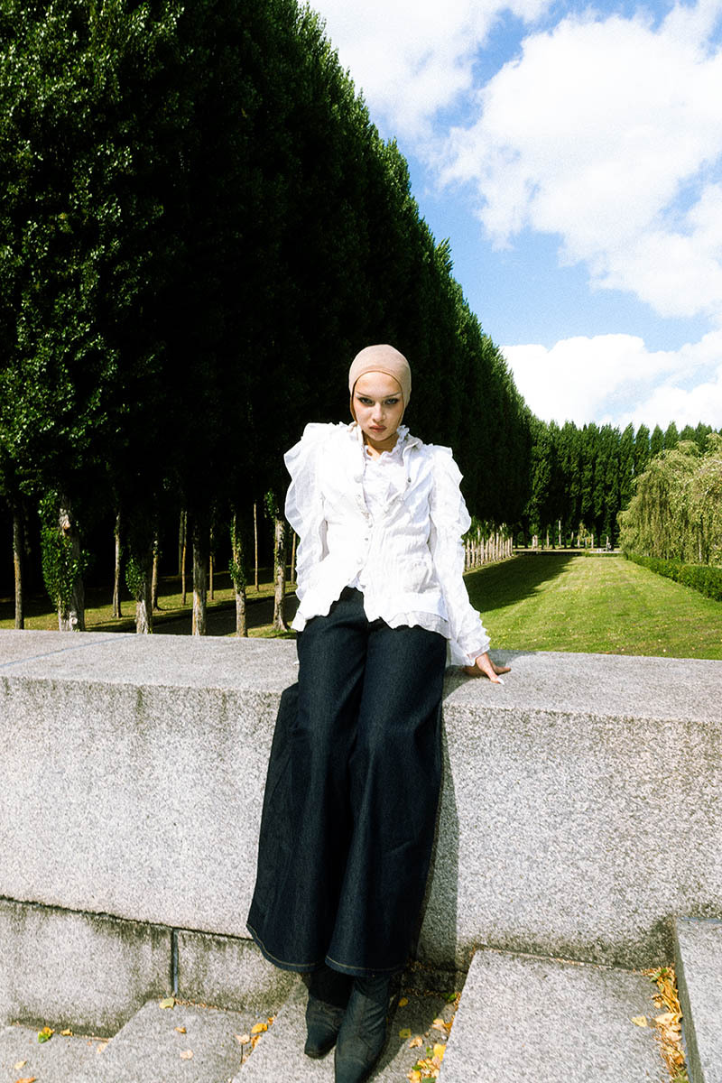 woman sitting on a building