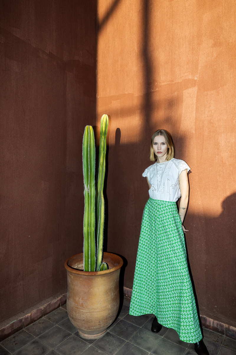 girl standing in front of a wall