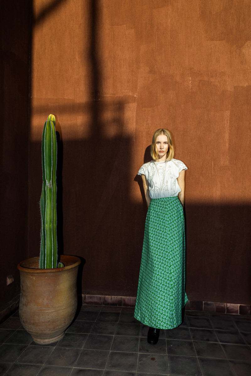 girl standing in front of a wall