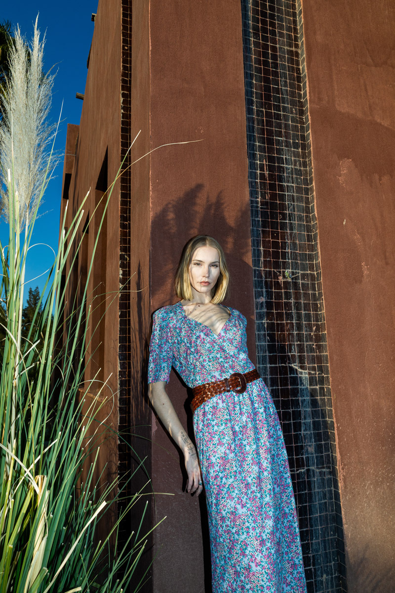 girl standing in front of a wall