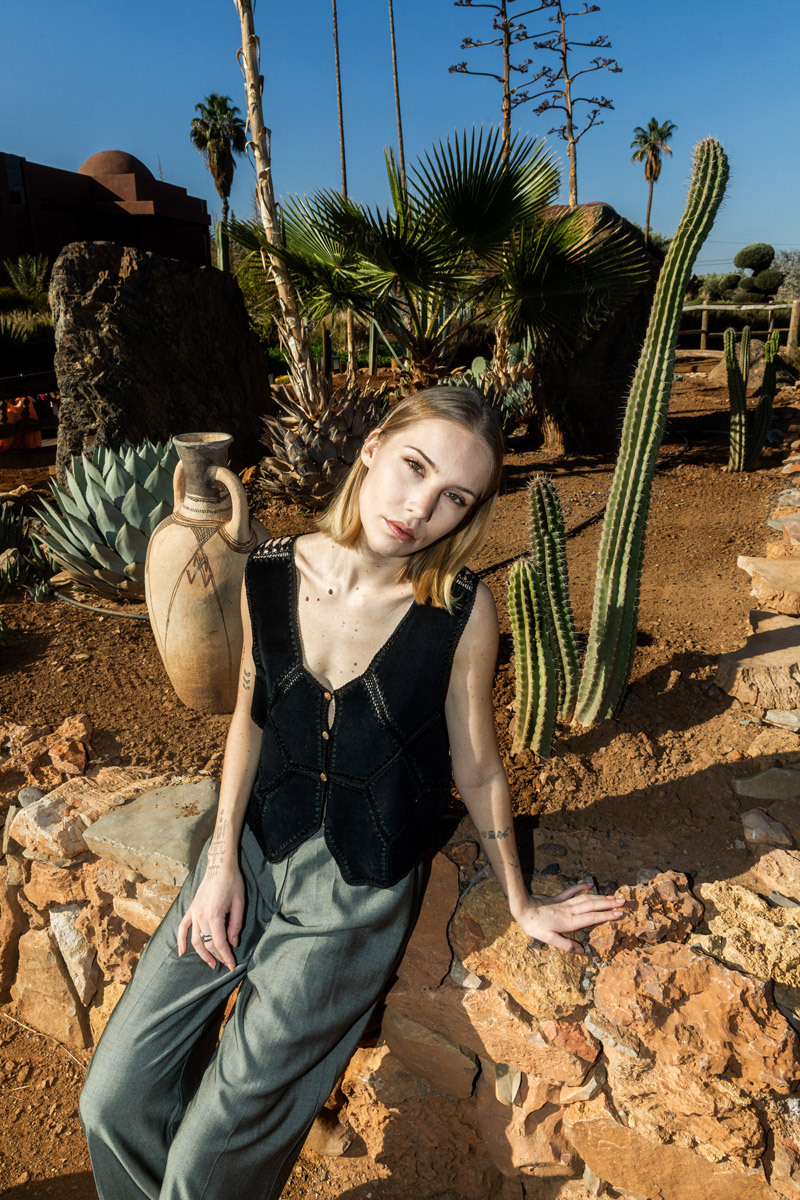 girl sitting on stones
